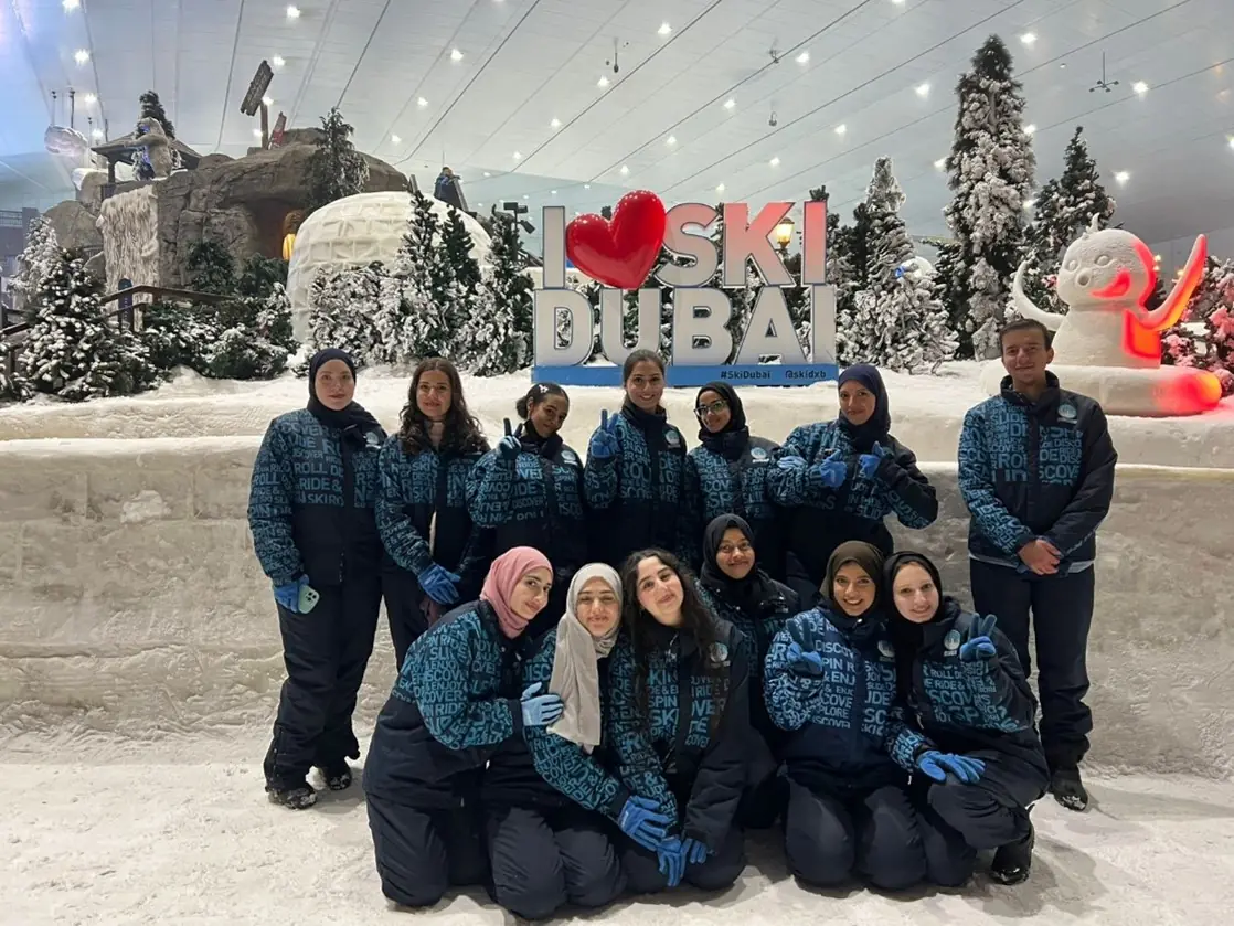 Branch members in ski suits at Ski Dubai
